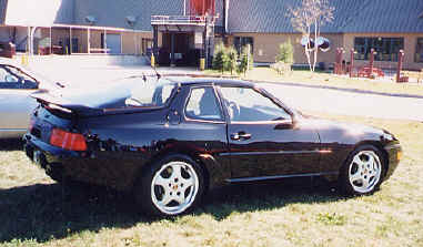 Dick Minesinger
"A total of 12,779 model 968 cars were built. During the production years, 2,417 coupes, model years 1992-1995, were sold in the US. Mine is a '93 black/black coupe which I purchased used in 1996, now with 72,000 miles.

This car has the Sport Chassis option, originally to be designated P30 and available on 1992 models, but actually delayed until the 1993 model year and then called the M30 option. The option includes bigger stabilizer bars, bigger cross-drilled brake discs, adjustable shocks, and 17" wheels. A further option is the limited slip differential. It is essentially track ready.

The engine represents a further development of what had been the 944 S2 engine: 3.0 liter, 4-cylinder, 16 valve, developing 236 HP and 225 ft-lbs of torque.

I love the car. I have frequently run it on race circuits in the US and Canada in DE events sponsored by PCA and trackmasters. It is comfortable for lengthy road trips; it has run in rallies; and it has even done well in the occasional concours. Right now, it is stored for the winter, never having seen a snow flake." - Dick
