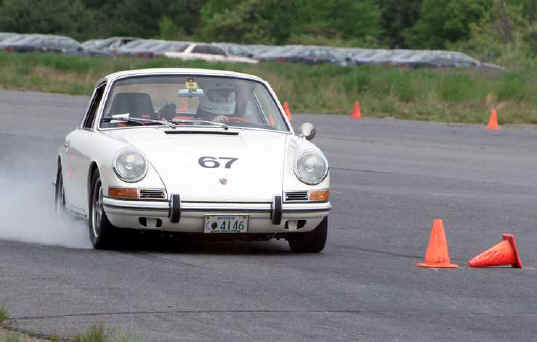 Eric Nichols
Eric Nichols' 1967 912. "The car has owned me since 1985. Regular autox and
occasional DE competitor since 1988. 2000 Parade driving event class winner.
Photo from Ft. Devens 31 May 2003." - Eric
