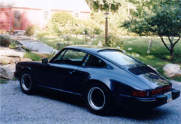 Immo Christoph
1985 Carrera Coupe, Prussian Blue Metallic, All available options, 
All original (Except tires and battery)

Pictured in front of the oldest standing Colonial house in New Boston, NH (1736).
Immo bought this car new in April 1985 through Porsche European delivery in Zuffenhausen.
