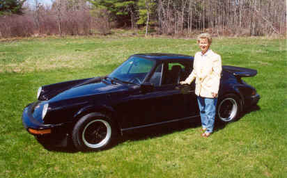 Karl Rau
"1986 911 black on black....  3rd Porsche  I've owned.... the lady in the picture is Sharon Belanger, we are getting married on June 30th.... the first time I let her drive the car, we were on Interstate 95 and a BMW passed us doing perhaps 120... Sharon looks at me and said we cant let them pass us now can we.....  I smiled and off she went.... didnâ€™t dare look at speedo!!!!... but we caught them haha...  then I thought to myself anyone that can drive like that first time out in a 911.... welll gotta marry her!!!   happy driving...." - Karl Rau
